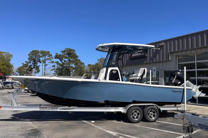 The Image of 2026 Tidewater 2500 Carolina Bay boat on trailer, parked outside dealership. - 0