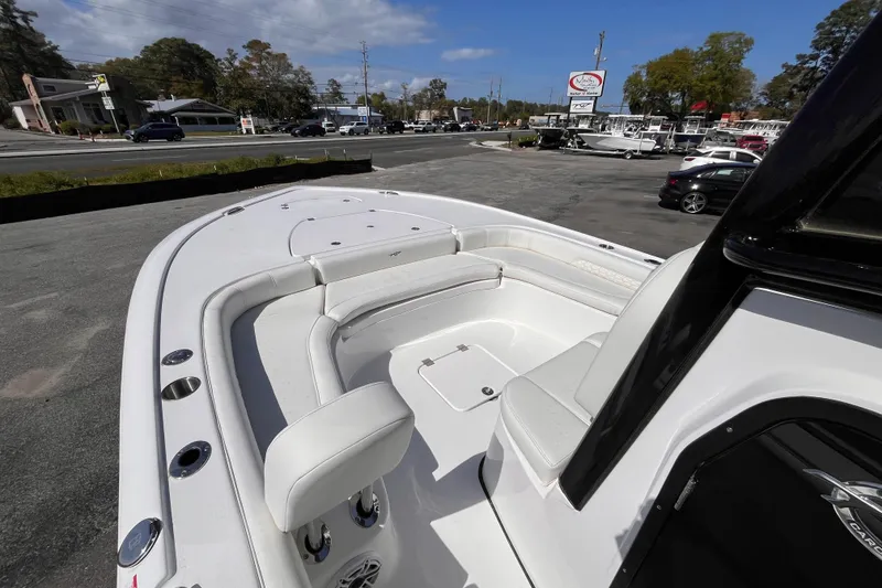 Slide: The Image of 2026 Tidewater 2500 Carolina Bay boat with spacious seating, parked outdoors. - 11
