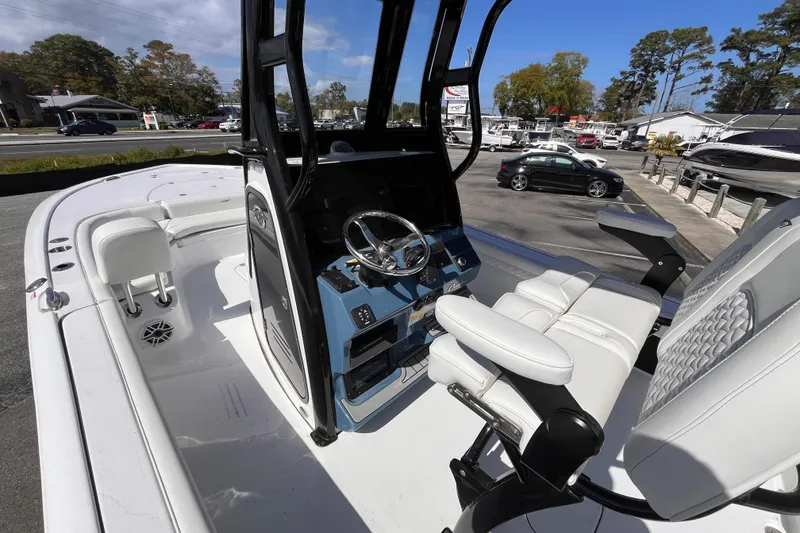 Slide: The Image of 2026 Tidewater 2500 Carolina Bay boat interior with modern helm and seating. - 12