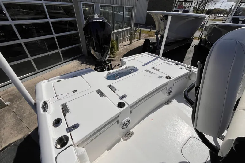 Slide: The Image of 2026 Tidewater 2500 Carolina Bay boat with spacious deck and modern outboard motor. - 4