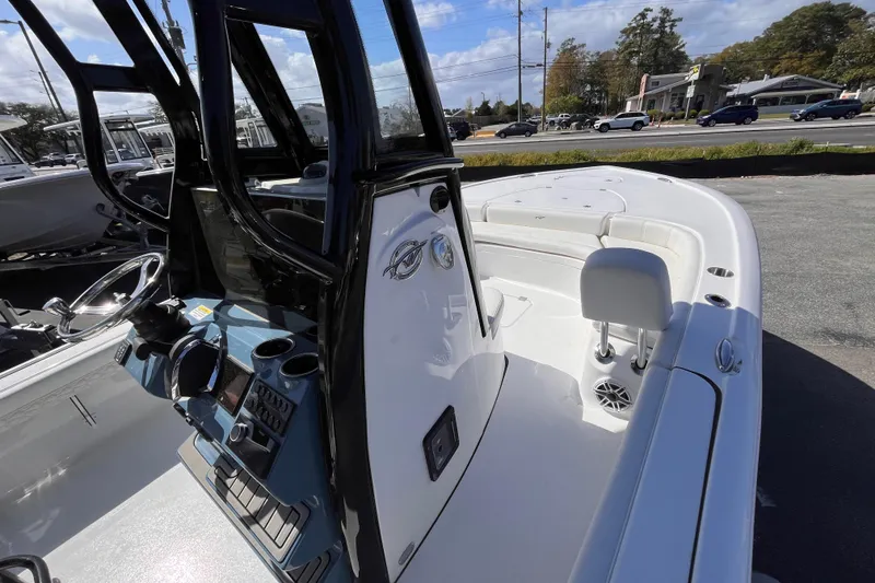 Slide: The Image of 2026 Tidewater 2500 Carolina Bay boat interior with steering console and seating. - 8