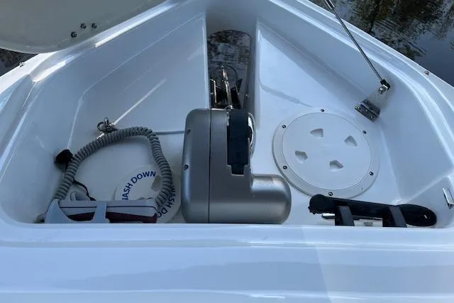 Slide: The Image of 2020 Four Winns H290 OB boat anchor compartment with winch and storage features. - 11