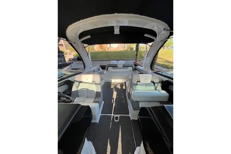 Slide: The Image of Interior view of 2020 Four Winns H290 OB boat with seating and canopy. - 5