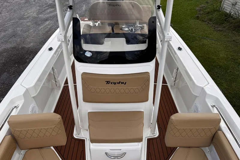 Slide: The Image of 2023 Bayliner Trophy T20CC boat interior with tan seating and sleek design. - 13