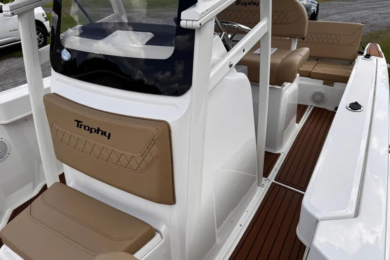 Slide: The Image of 2023 Bayliner Trophy T20CC boat interior with tan seating and sleek design. - 17