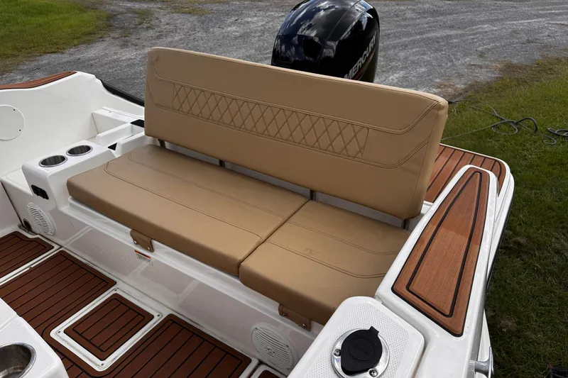 Slide: The Image of 2023 Bayliner Trophy T20CC boat with tan seating and wood accents. - 22