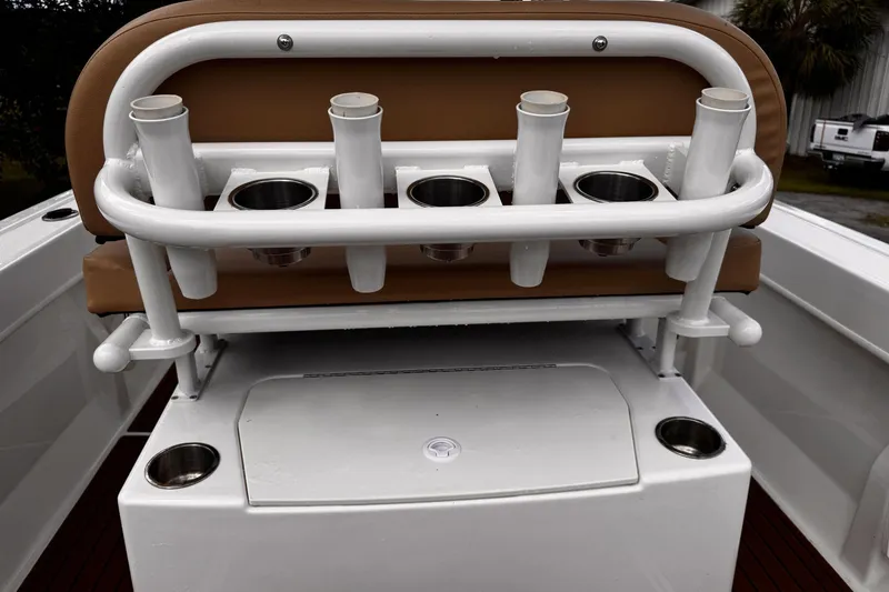 Slide: The Image of 2023 Bayliner Trophy T20CC boat seating with rod holders and cup holders. - 28