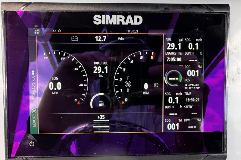 Slide: The Image of Simrad display on 2023 Bayliner Trophy T20CC showing fuel and navigation data. - 8