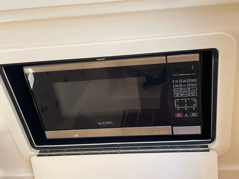 Slide: The Image of Built-in microwave in 2016 Grady-White Freedom 335 boat kitchen area. - 21