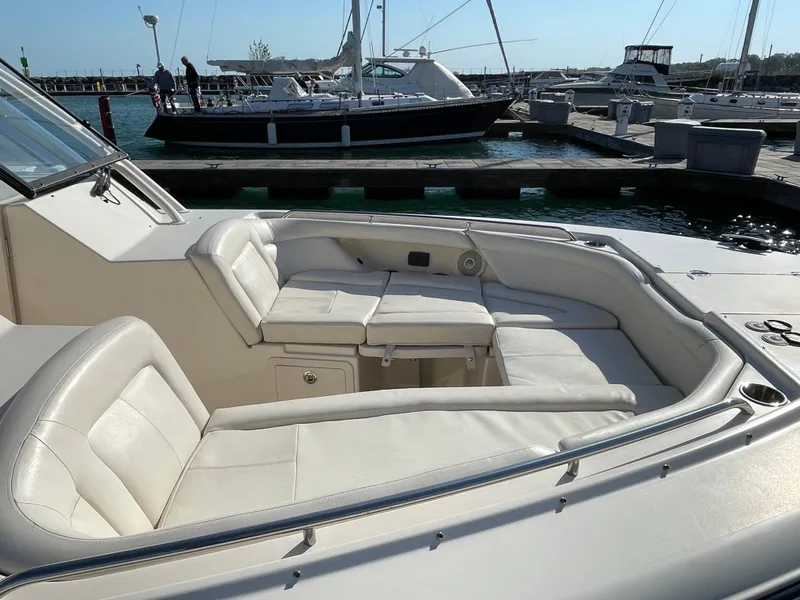 Slide: The Image of 2016 Grady-White Freedom 335 boat with spacious seating at a marina. - 23