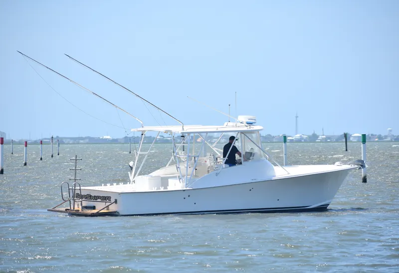 Slide: The Image of 2004 Judge 34 Express boat cruising on a sunny day. - 6