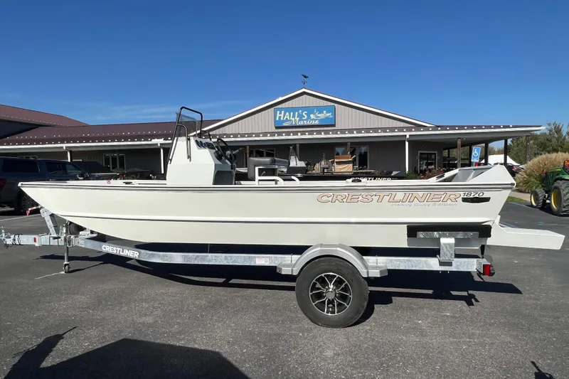 The Image of 2026 Crestliner 1870 Retriever FCC boat on trailer outside Hall's Marine. - 0