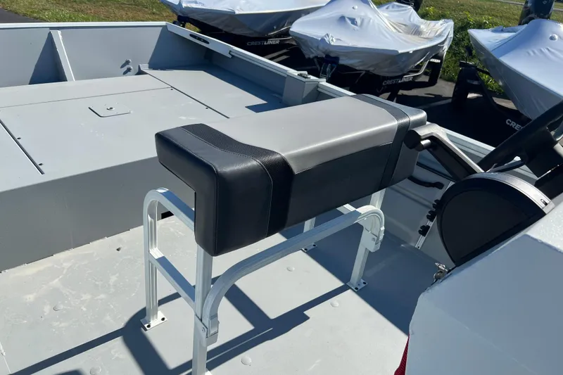Slide: The Image of 2026 Crestliner 1870 Retriever FCC boat interior with seating and steering console. - 10