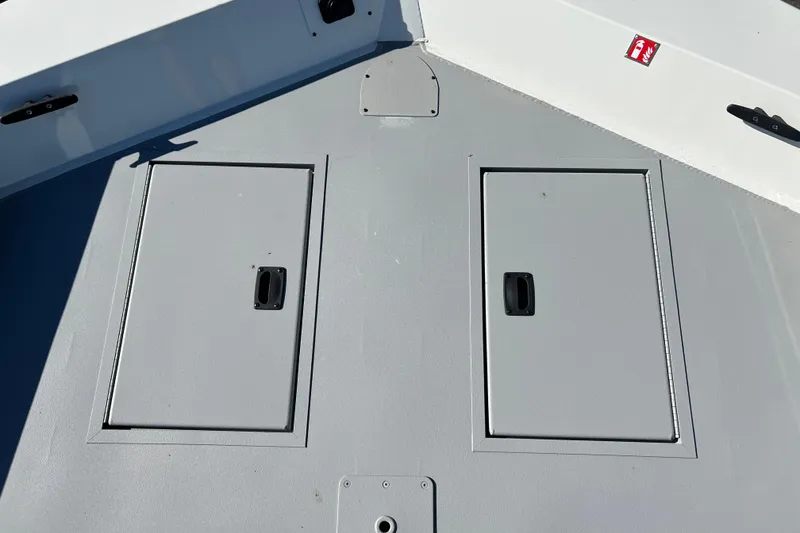 Slide: The Image of 2026 Crestliner 1870 Retriever FCC boat deck with storage compartments. - 5