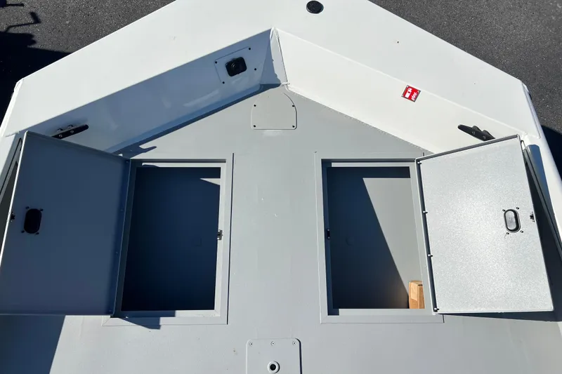 Slide: The Image of 2026 Crestliner 1870 Retriever FCC boat deck with open storage compartments. - 6