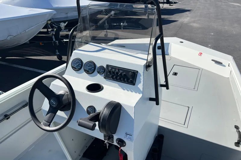 Slide: The Image of 2026 Crestliner 1870 Retriever FCC boat dashboard with steering wheel and gauges. - 7