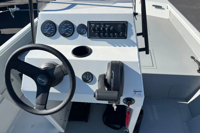 Slide: The Image of 2026 Crestliner 1870 Retriever FCC boat console with steering wheel and control panel. - 8