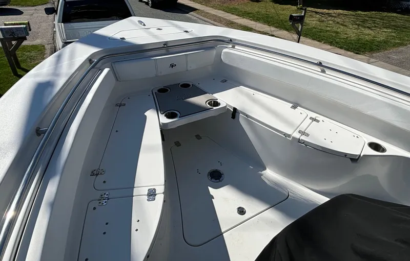 Slide: The Image of 2022 Sea Pro 239 Center Console boat interior with seating and storage compartments. - 10