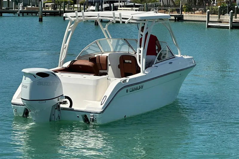 Slide: The Image of 2019 Century 24 Resorter boat with Suzuki engine on turquoise water. - 12