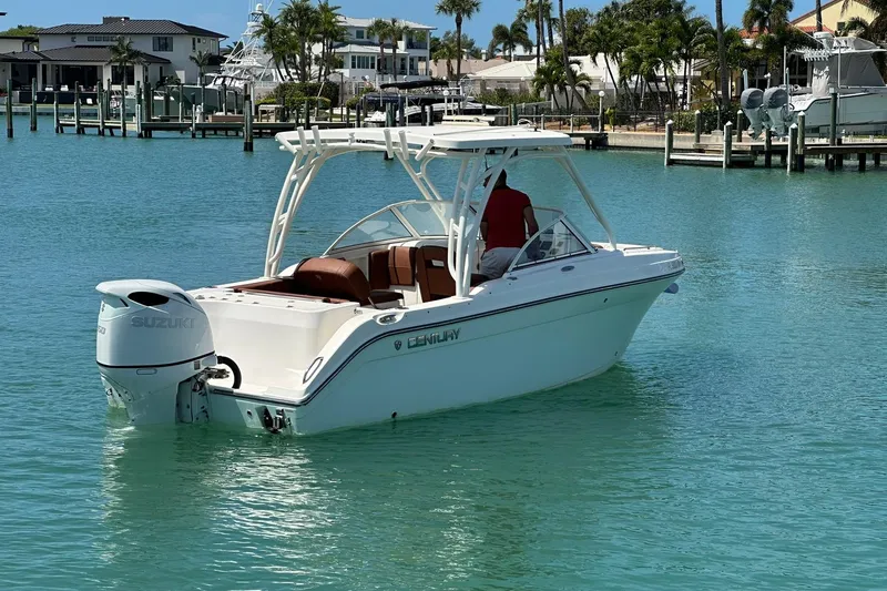 Slide: The Image of 2019 Century 24 Resorter boat on turquoise water near a marina. - 13