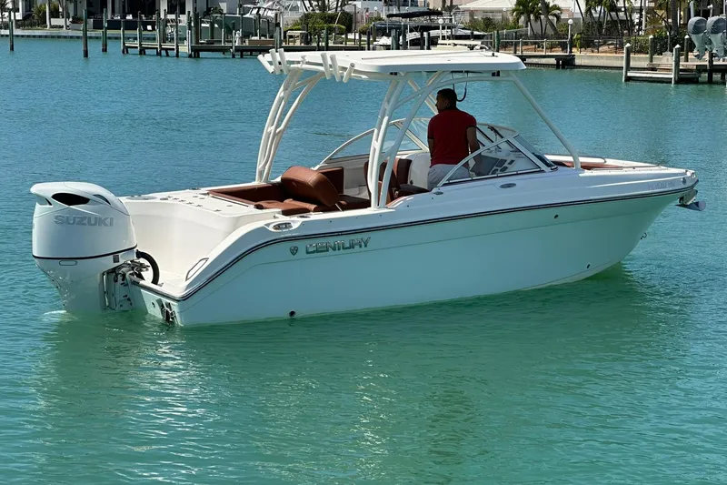 Slide: The Image of 2019 Century 24 Resorter boat with Suzuki engine on turquoise water. - 14