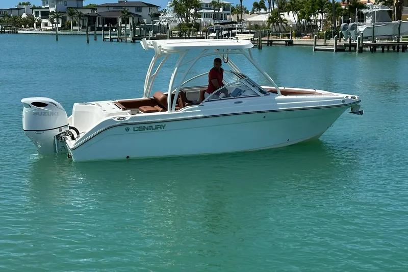 Slide: The Image of 2019 Century 24 Resorter boat on turquoise water near a marina. - 15