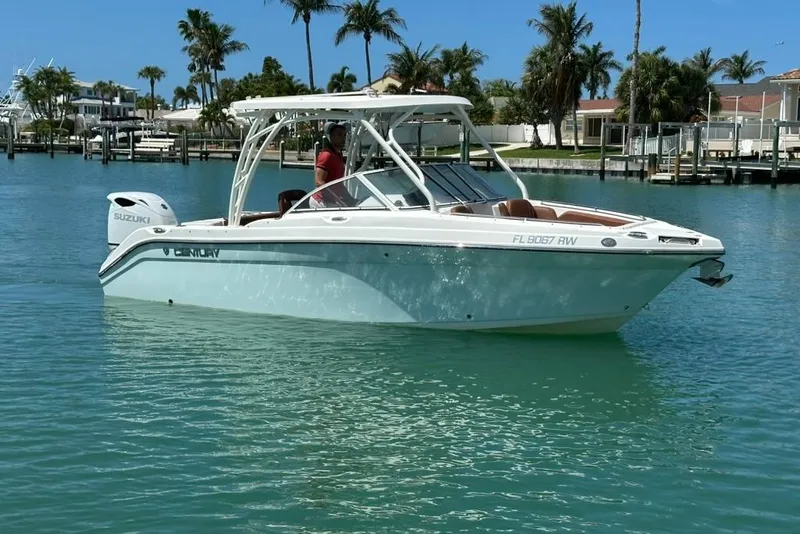 Slide: The Image of 2019 Century 24 Resorter boat on clear blue water with palm trees in the background. - 16