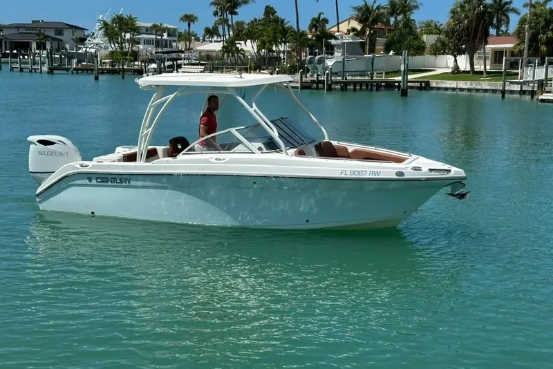 Slide: The Image of 2019 Century 24 Resorter boat on clear blue water, dockside view. - 17