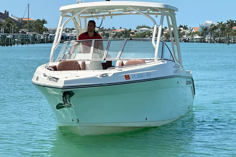 Slide: The Image of 2019 Century 24 Resorter boat cruising on clear turquoise water. - 2