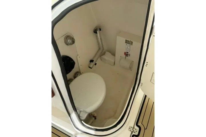 Slide: The Image of 2019 Century 24 Resorter boat interior with compact marine toilet. - 36