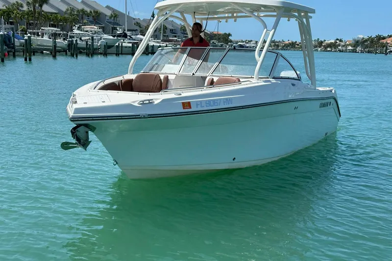 Slide: The Image of 2019 Century 24 Resorter boat on clear turquoise water near marina. - 4