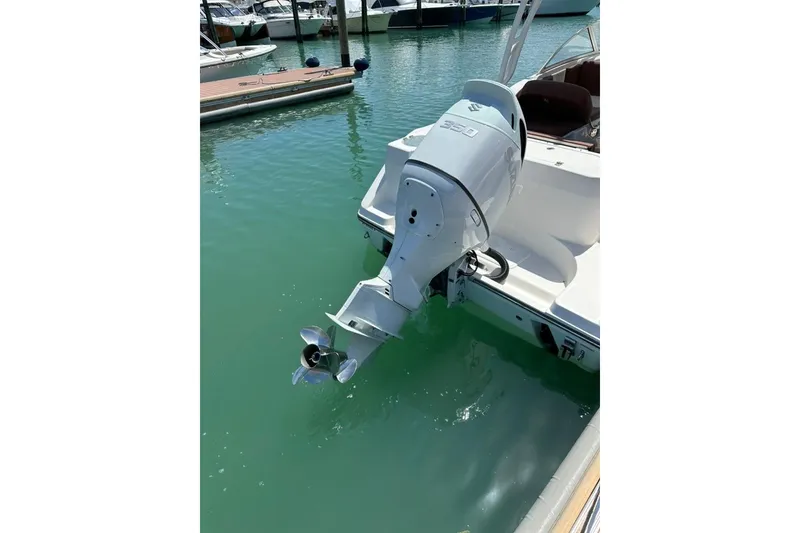 Slide: The Image of 2019 Century 24 Resorter boat with powerful outboard motor in marina. - 40