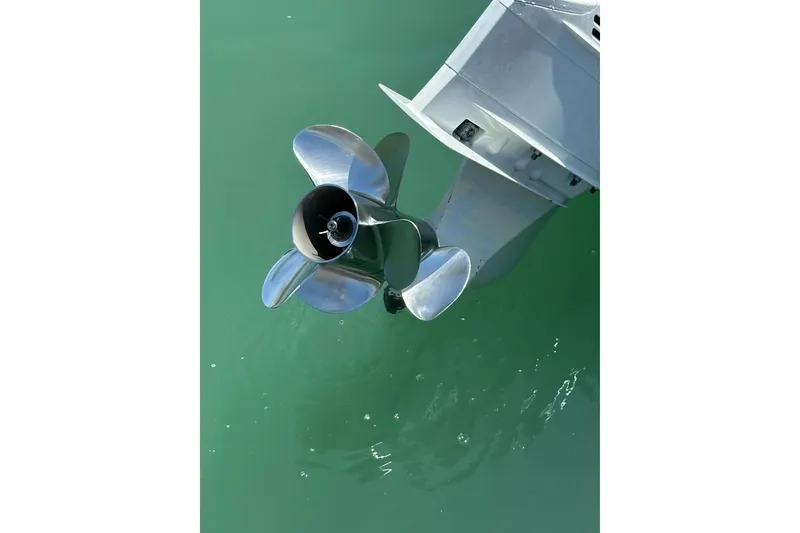 Slide: The Image of Propeller of 2019 Century 24 Resorter boat in clear green water. - 41