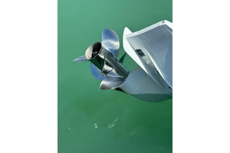 Slide: The Image of Stainless steel boat propeller on a 2019 Century 24 Resorter in green water. - 42