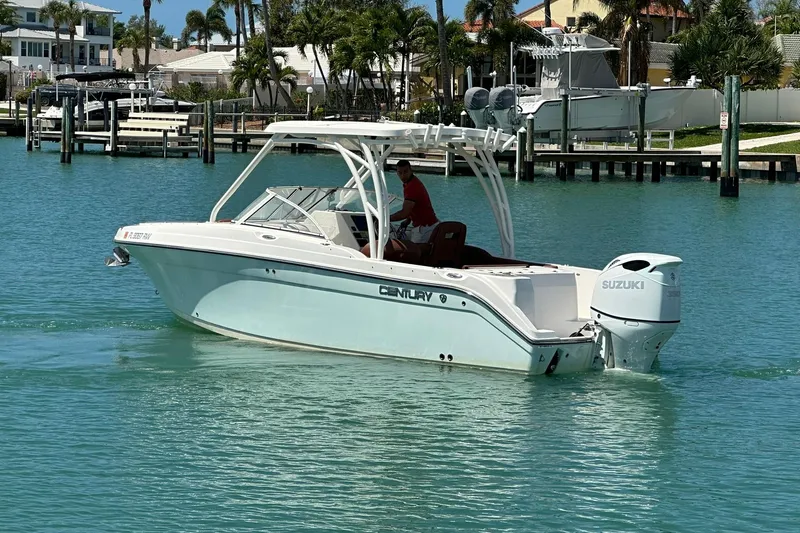 Slide: The Image of 2019 Century 24 Resorter boat with Suzuki engine on turquoise water. - 6