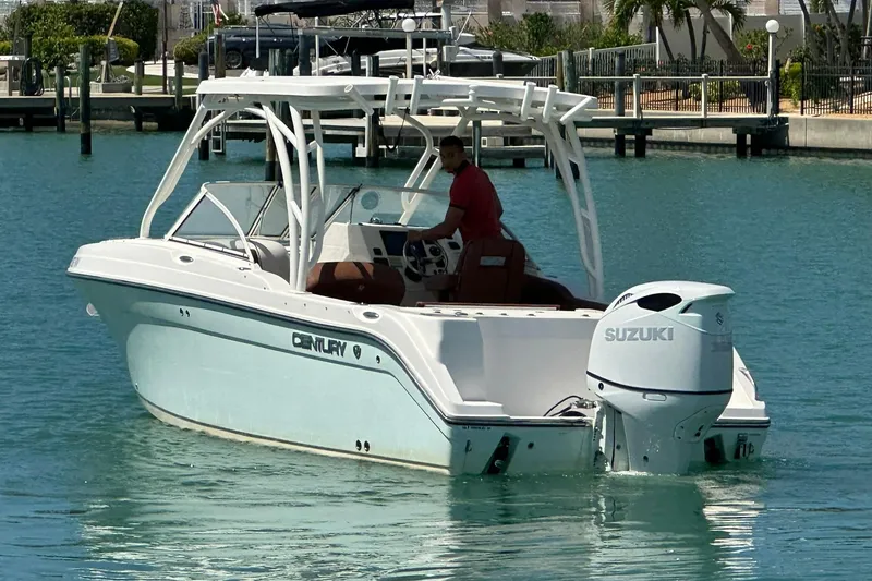 Slide: The Image of 2019 Century 24 Resorter boat with Suzuki engine on turquoise water. - 7