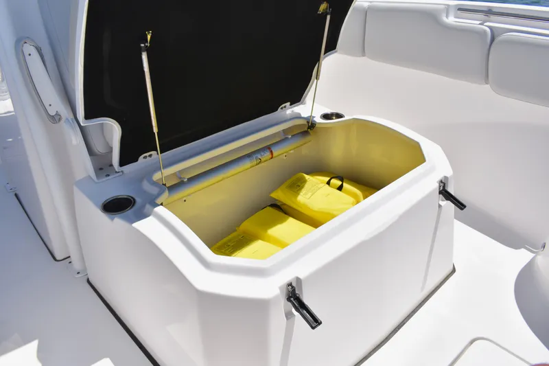 Slide: The Image of Open storage compartment on 2020 Sea Fox 288 Commander boat with yellow life jackets. - 27