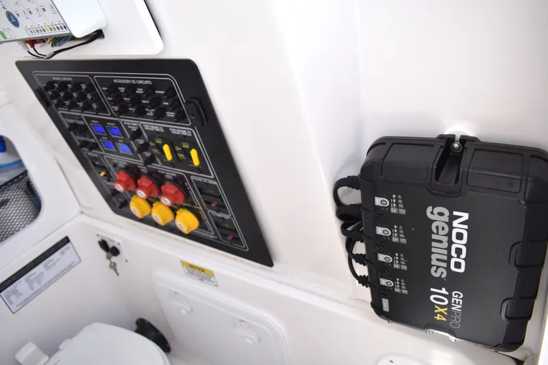 Slide: The Image of Electrical panel and NOCO Genius charger on 2020 Sea Fox 288 Commander boat. - 32