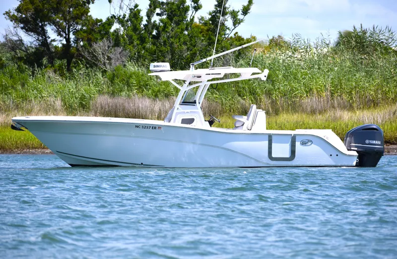 Slide: The Image of 2020 Sea Fox 288 Commander boat on water, side view, with Yamaha engine. - 8