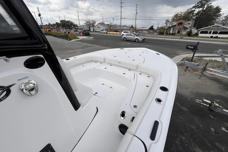 Slide: The Image of 2026 Tidewater 2500 Carolina Bay boat on a parking lot. - 10