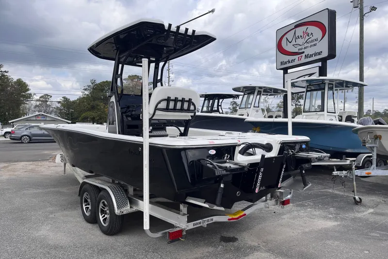Slide: The Image of 2026 Tidewater 2500 Carolina Bay boat on trailer at Marker 17 Marine. - 2