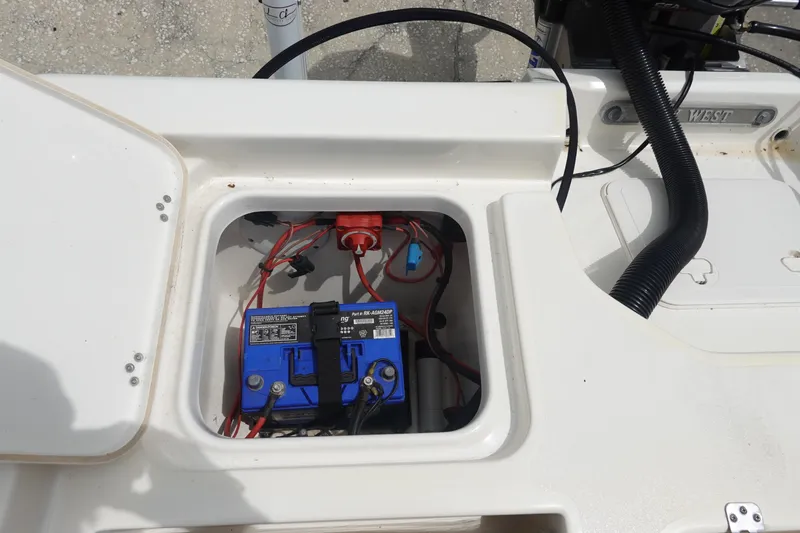 Slide: The Image of Battery compartment of a 2015 Key West 230 Bay Reef boat, featuring wiring and connections. - 10