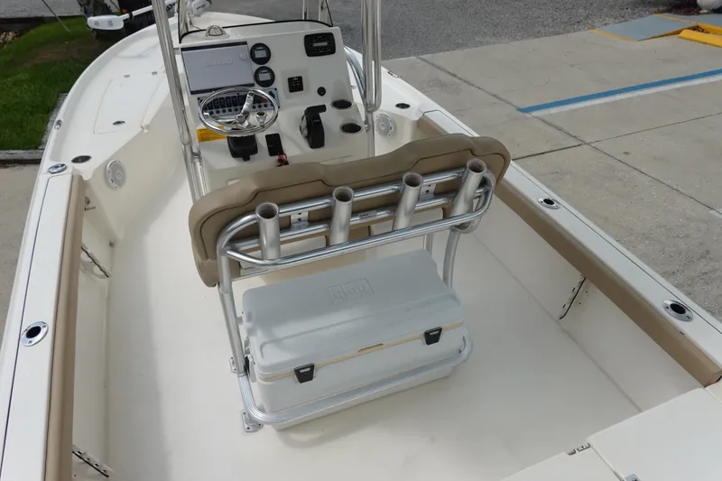 Slide: The Image of 2015 Key West 230 Bay Reef boat interior with steering console and seating. - 12