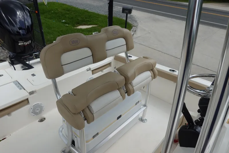 Slide: The Image of 2015 Key West 230 Bay Reef boat interior with dual beige seats and Yamaha 250 engine. - 14