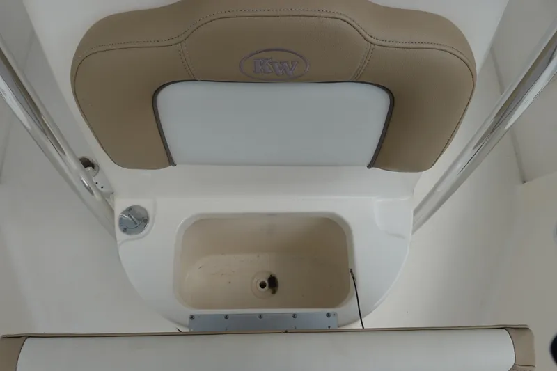 Slide: The Image of 2015 Key West 230 Bay Reef boat seat and storage compartment. - 18