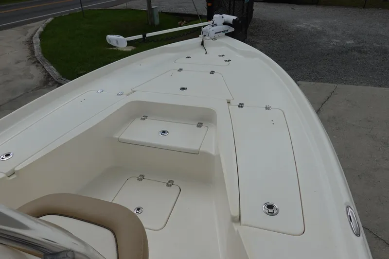 Slide: The Image of 2015 Key West 230 Bay Reef boat deck with storage compartments and trolling motor. - 19