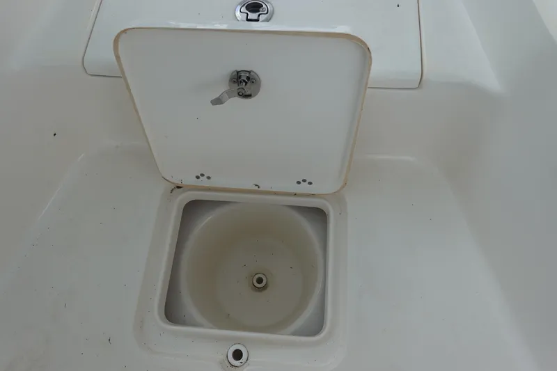 Slide: The Image of Open storage compartment on 2015 Key West 230 Bay Reef boat. - 20