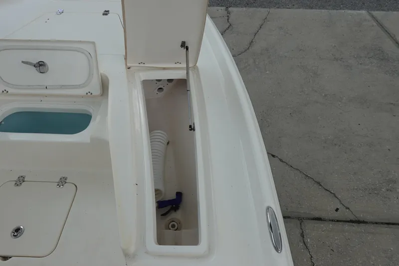 Slide: The Image of Open storage compartment on a 2015 Key West 230 Bay Reef boat deck. - 22