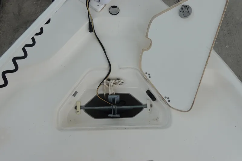 Slide: The Image of Bow storage compartment of a 2015 Key West 230 Bay Reef boat, featuring an open hatch. - 27