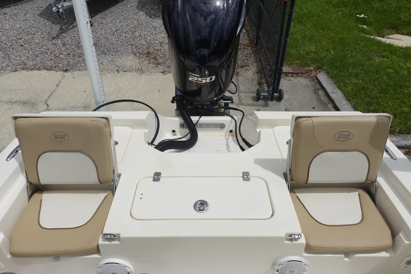 Slide: The Image of 2015 Key West 230 Bay Reef boat with Yamaha 250 engine, featuring beige seating. - 8